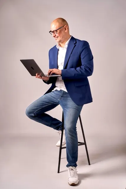 Checo Martínez working on his laptop