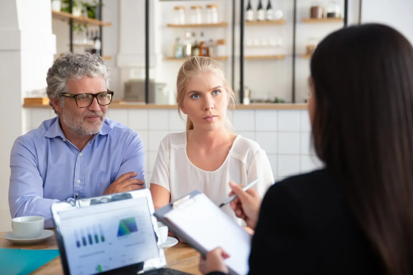 Advisor meeting with clients in a professional office